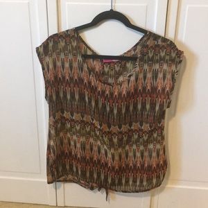 Sheer sleeveless top.